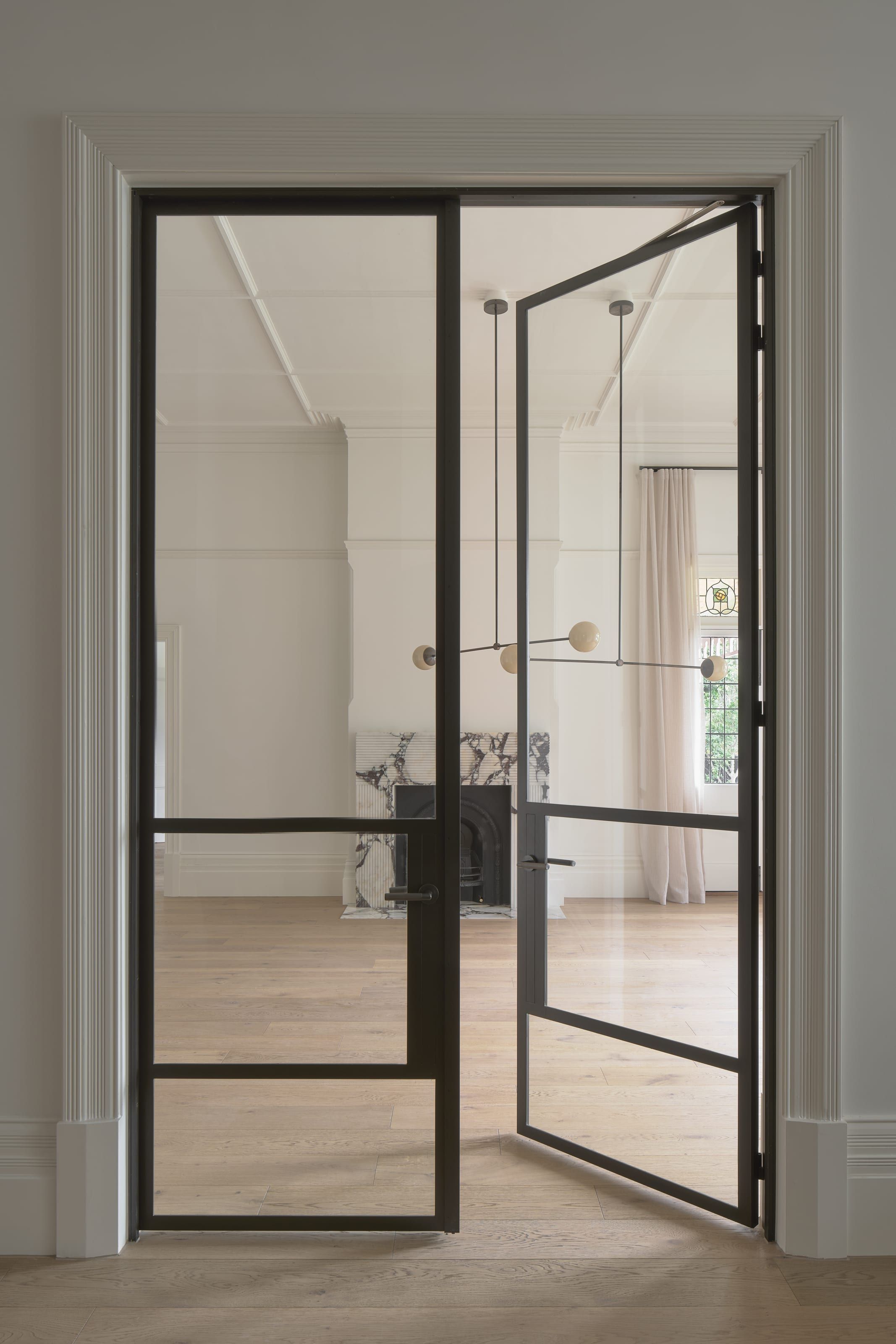 Restored interior openings with new steel-framed glazing