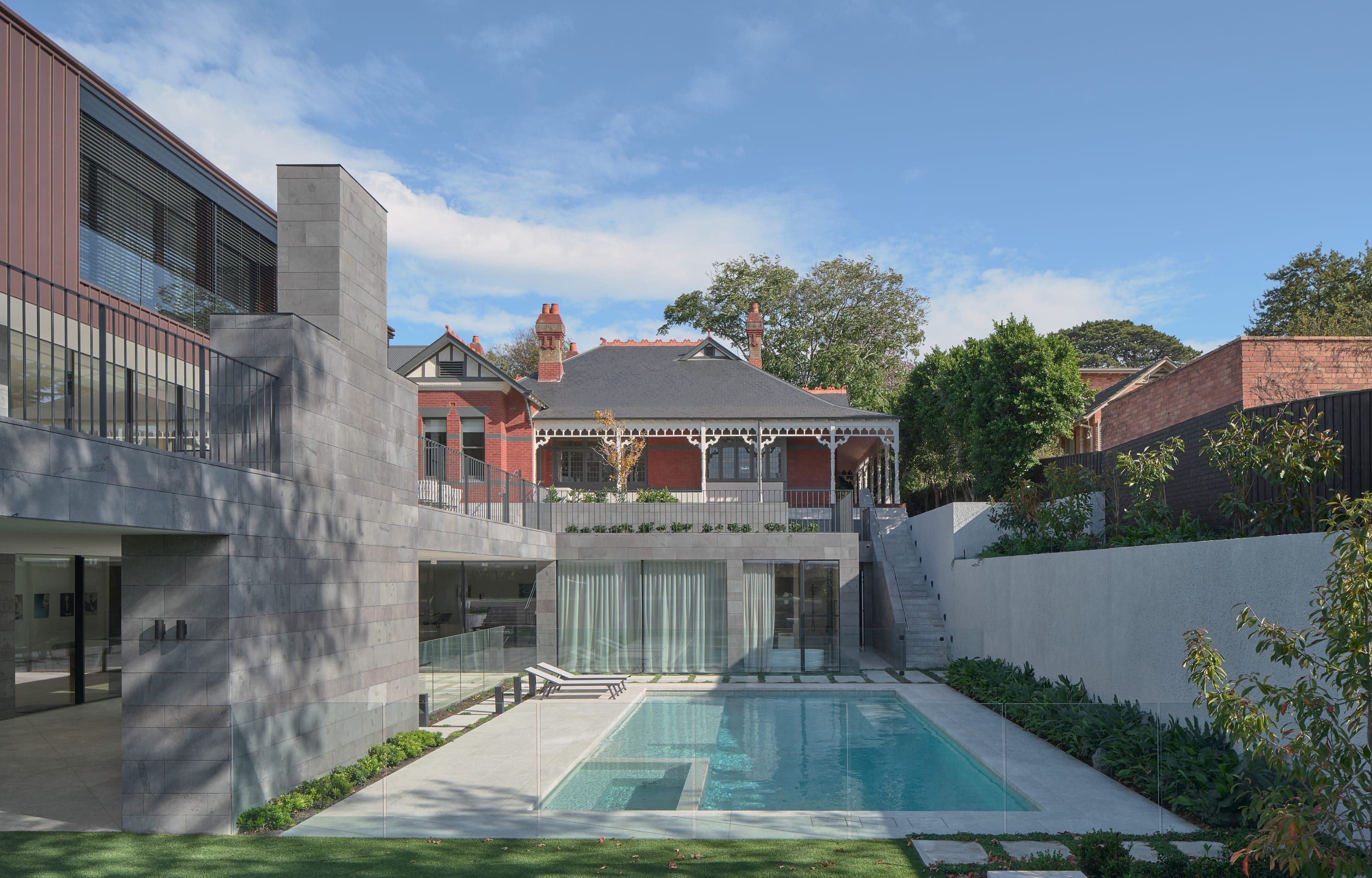 The rear garden, pool and restored heritage home at Cranston House